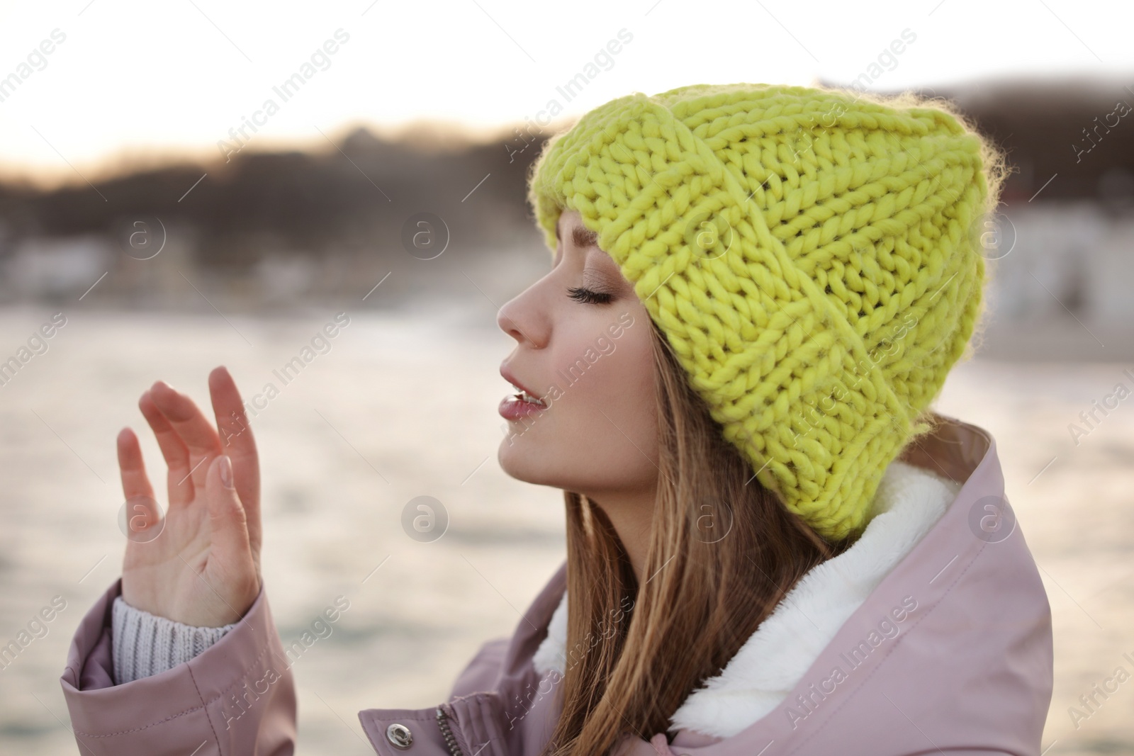 Photo of Portrait of stylish young woman near sea