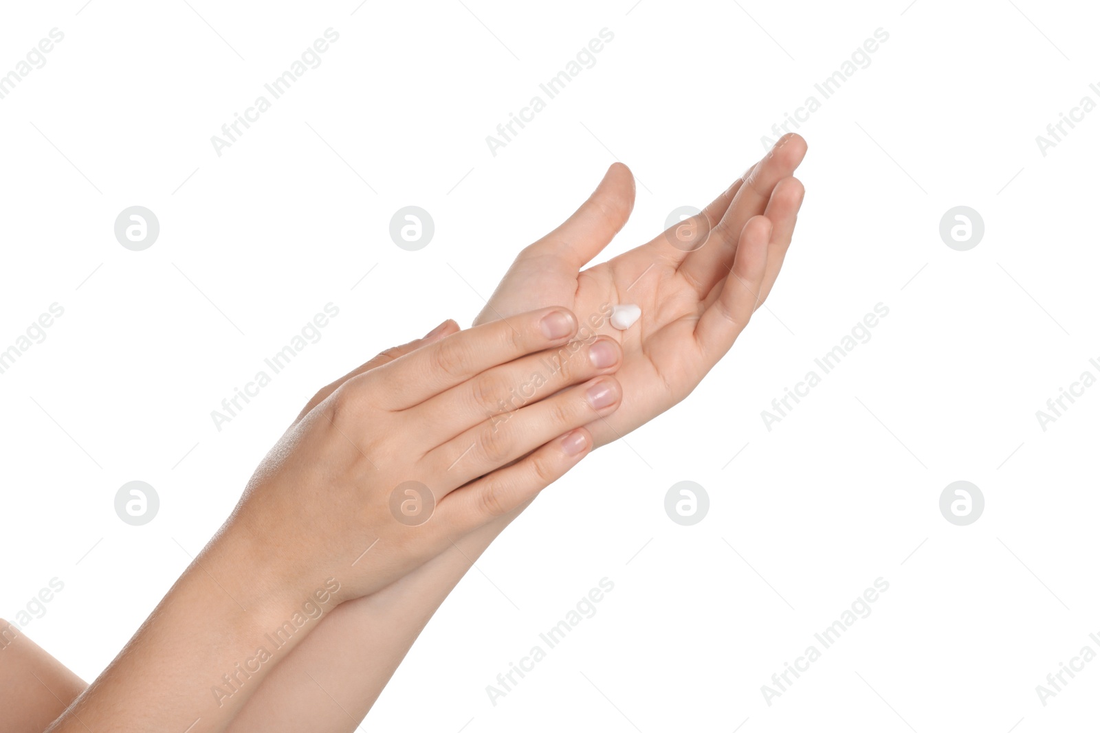 Photo of Woman applying cream on hand against white background, closeup