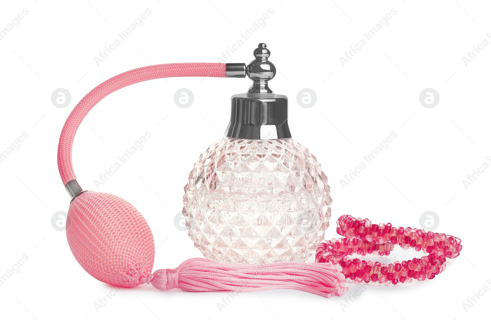 Photo of Glass bottle of perfume and luxury jewellery isolated on white