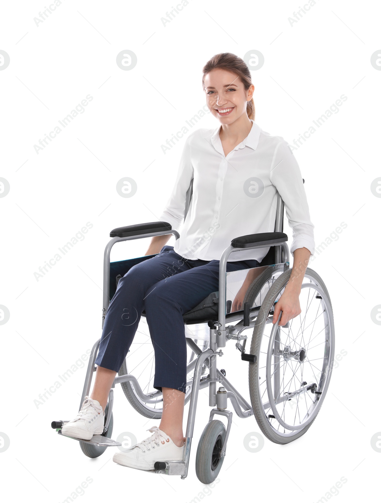 Photo of Young woman in wheelchair isolated on white