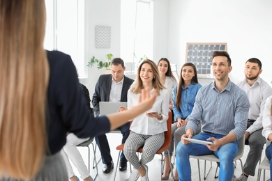 Photo of Young people having business training in office