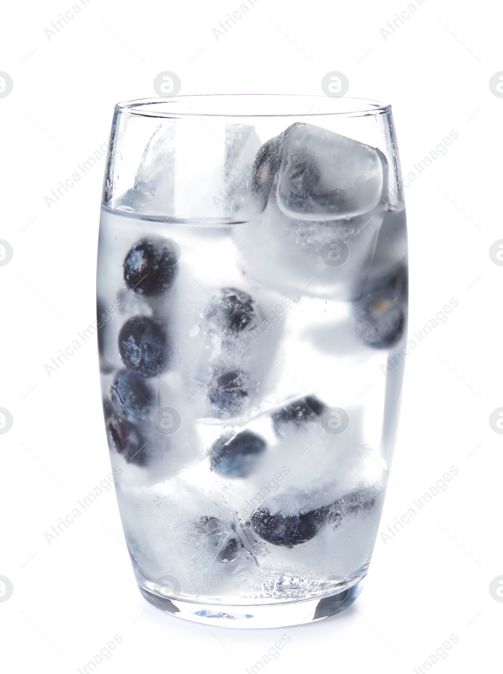 Photo of Glass of drink with blueberry ice cubes on white background