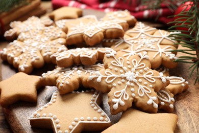 Photo of Tasty Christmas cookies on wooden table, closeup
