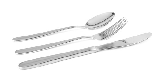 Photo of Fork, knife and spoon on white background