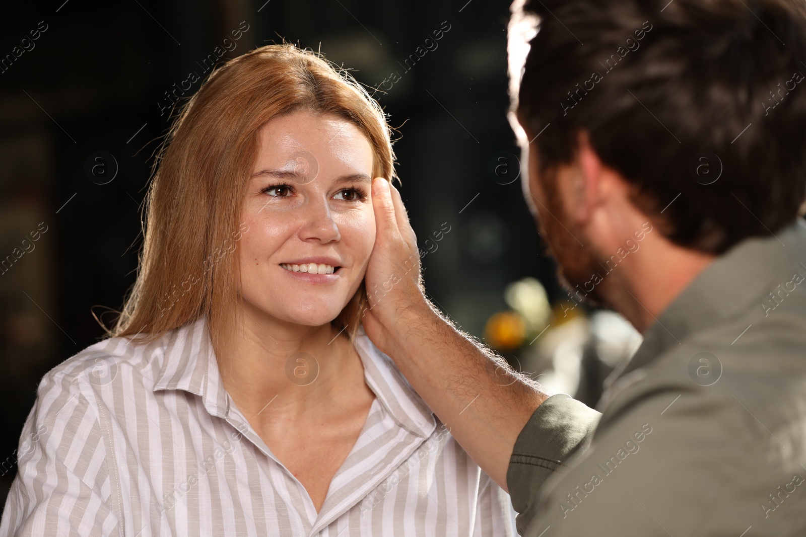 Photo of Romantic date. Lovely couple spending time together indoors