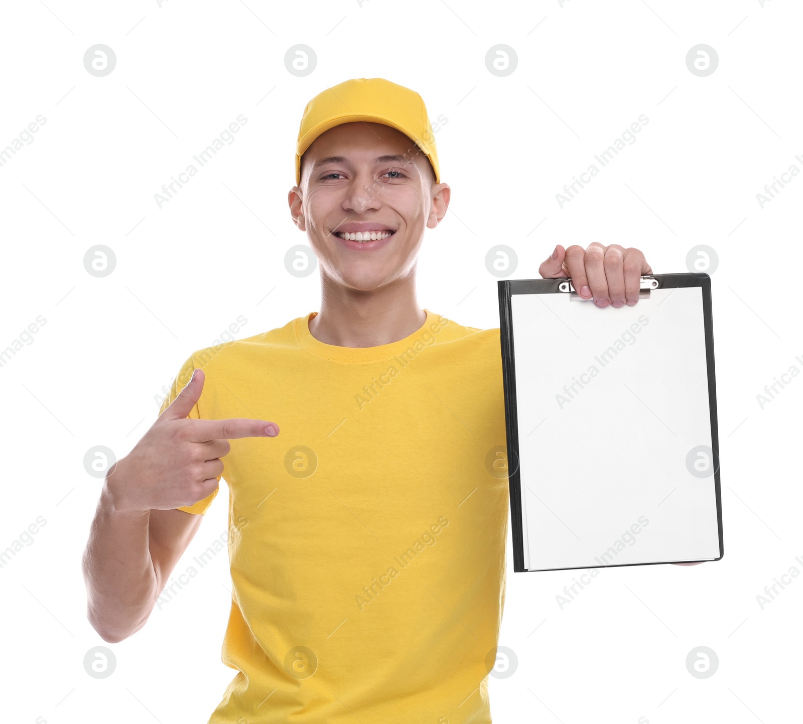 Photo of Happy courier pointing at clipboard on white background