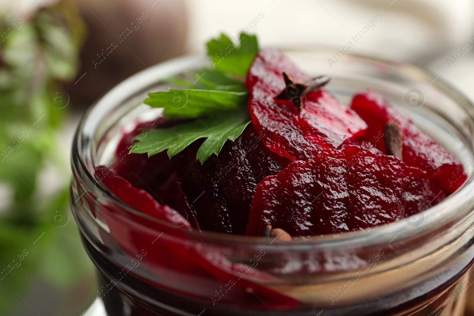 Photo of Delicious pickled beets in jar, closeup view