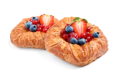 Photo of Fresh delicious puff pastry with sweet berries on white background