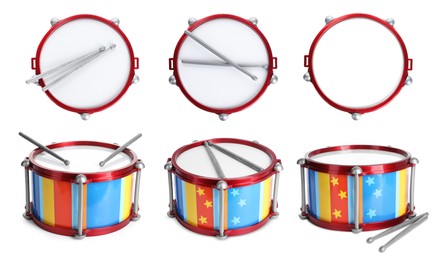 Image of Bright toy drums and sticks on white background, set