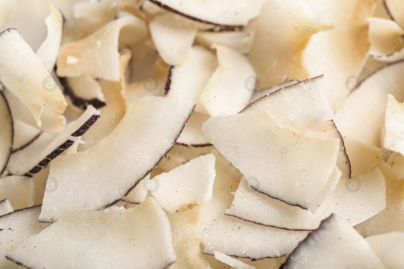 Photo of Delicious fresh coconut chips as background, closeup