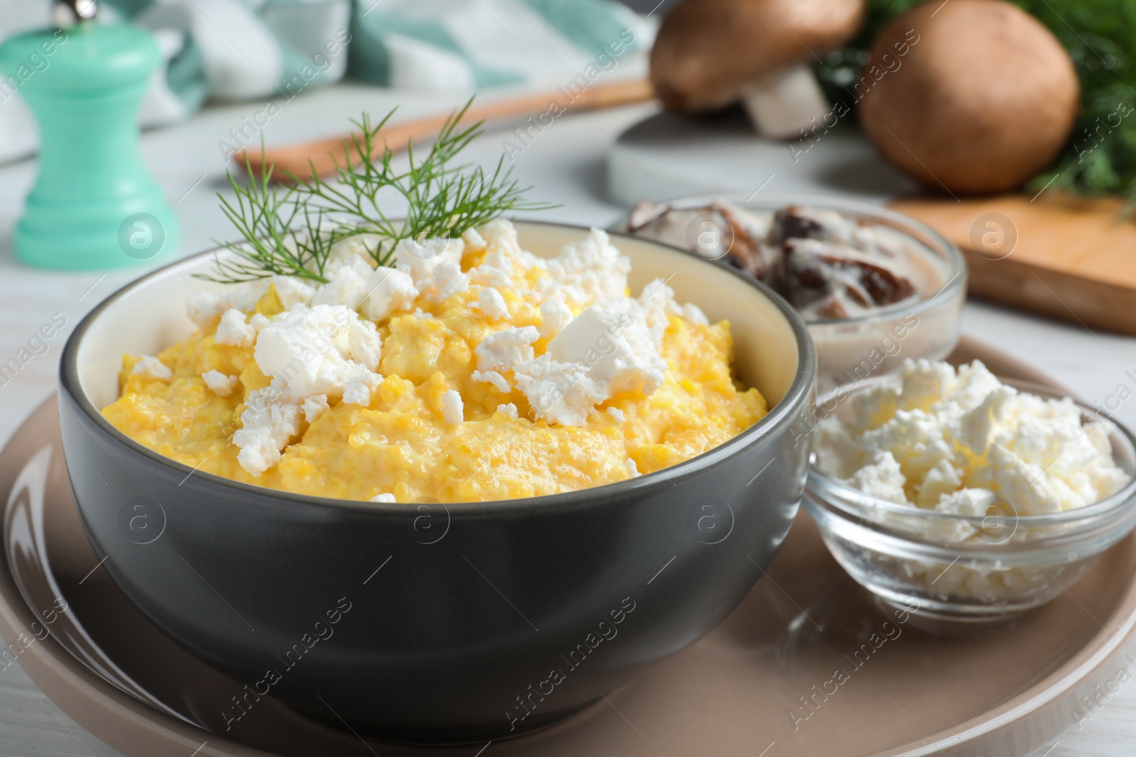 Photo of Delicious traditional banosh served on white wooden table