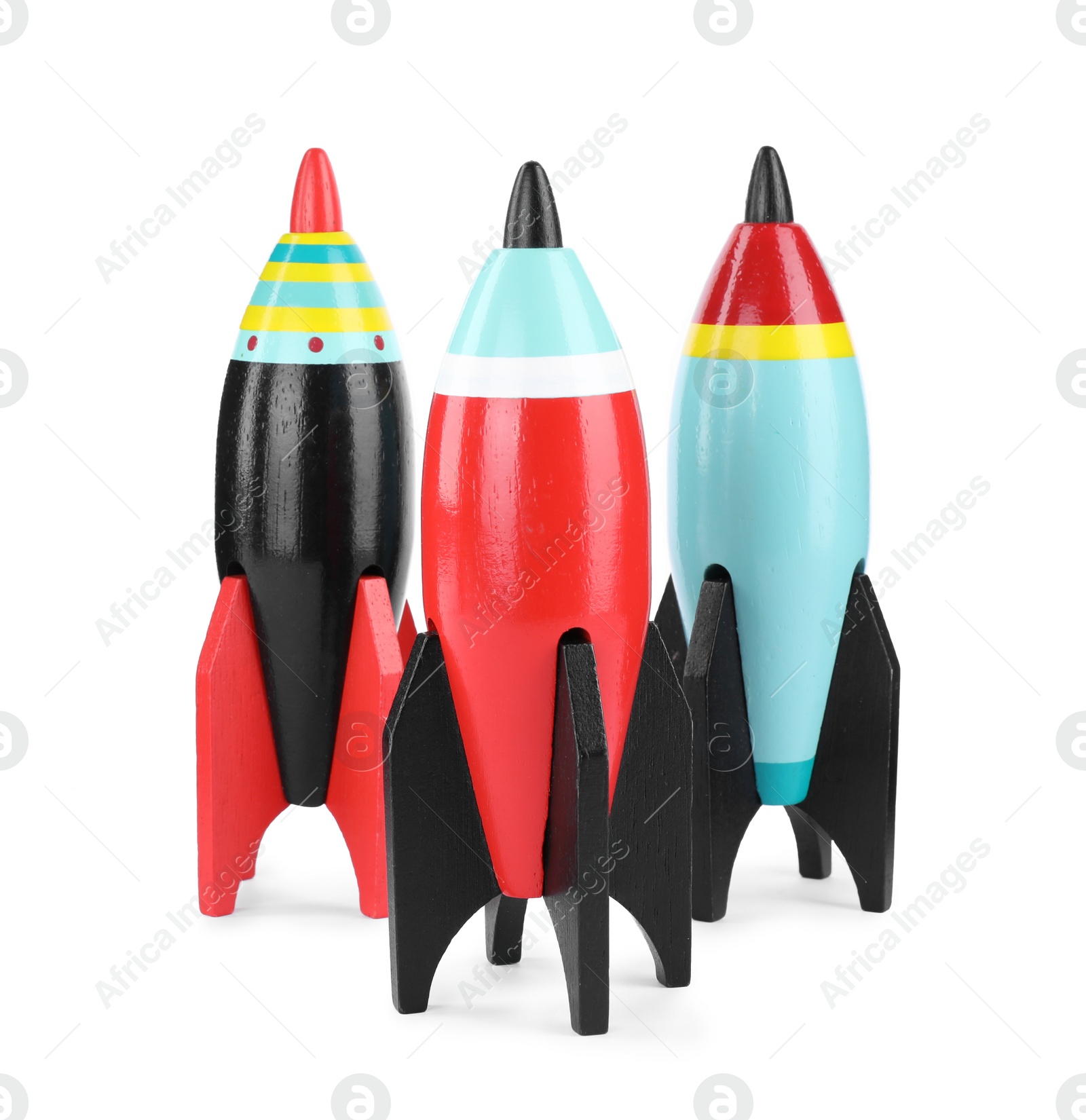Photo of Bright modern toy rockets isolated on white