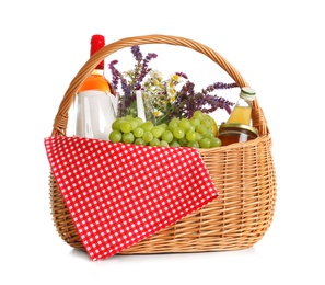 Photo of Picnic basket with flowers, wine and food isolated on white