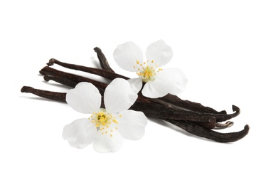 Aromatic vanilla sticks and flowers on white background