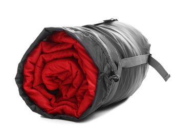 Photo of Sleeping bag in case on white background. Camping equipment