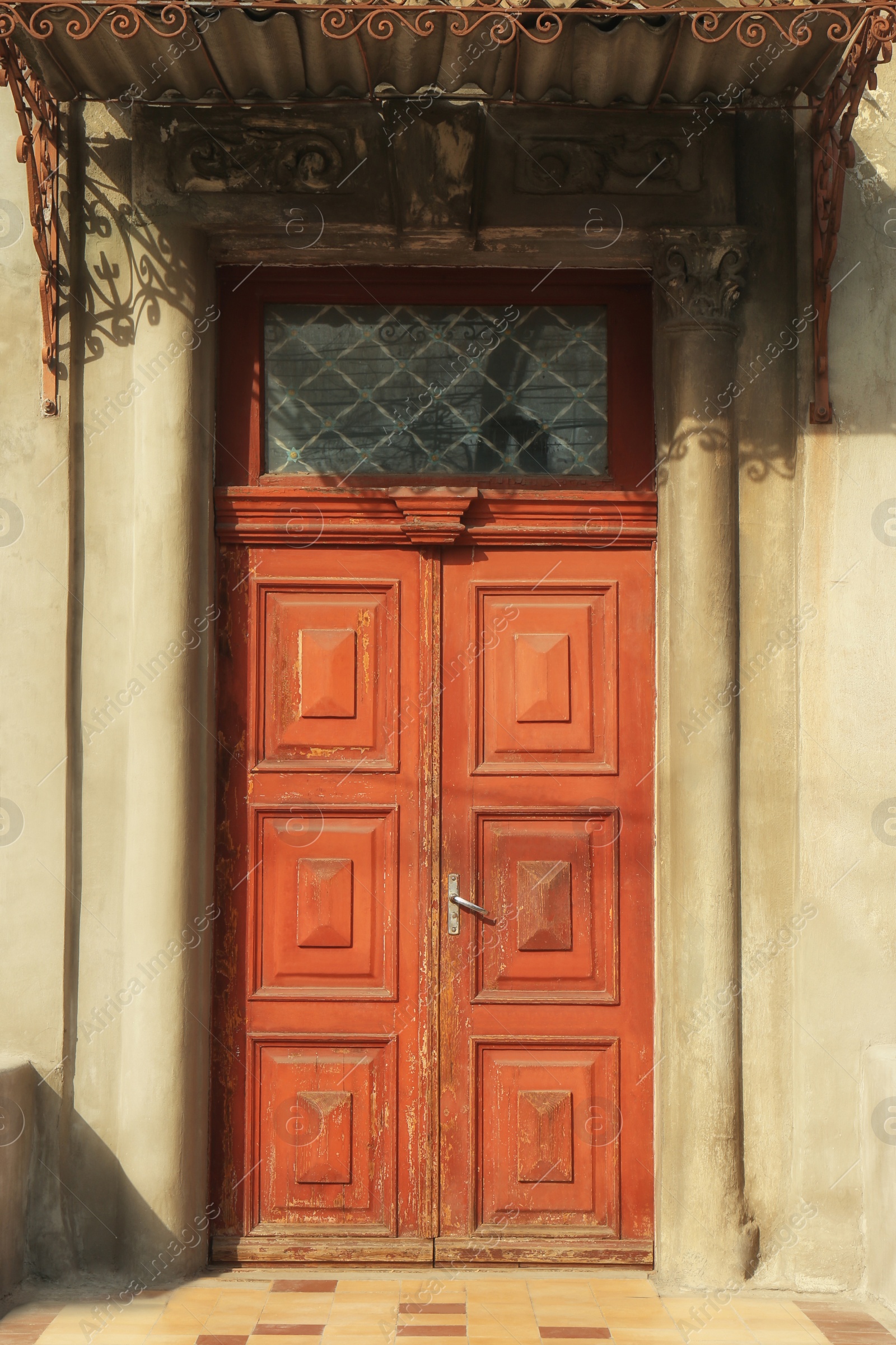 Photo of Closed vintage wooden door in old building