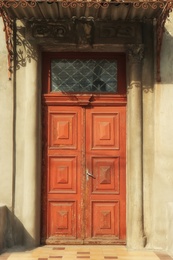 Closed vintage wooden door in old building