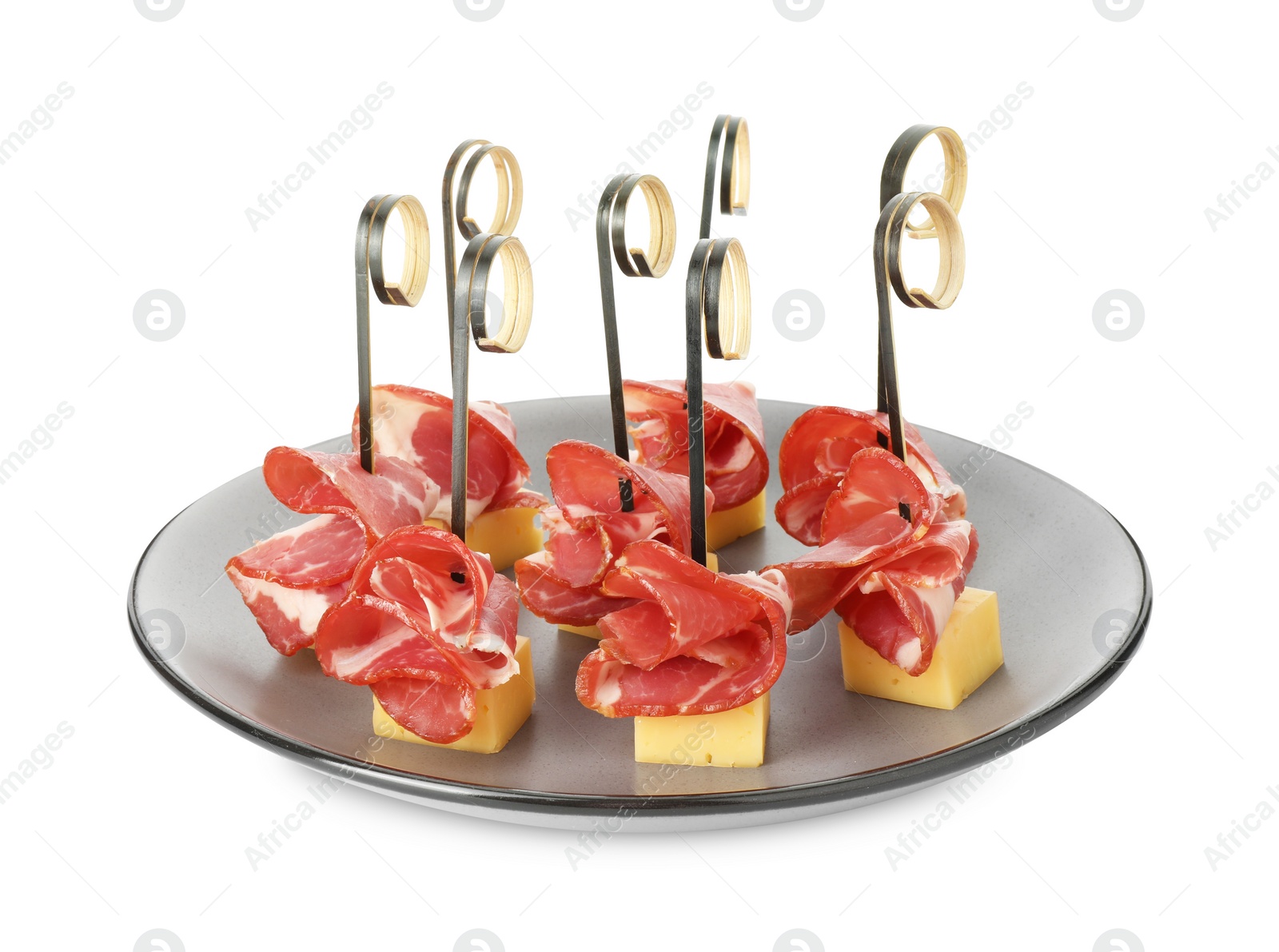 Photo of Tasty canapes with cheese and ham isolated on white
