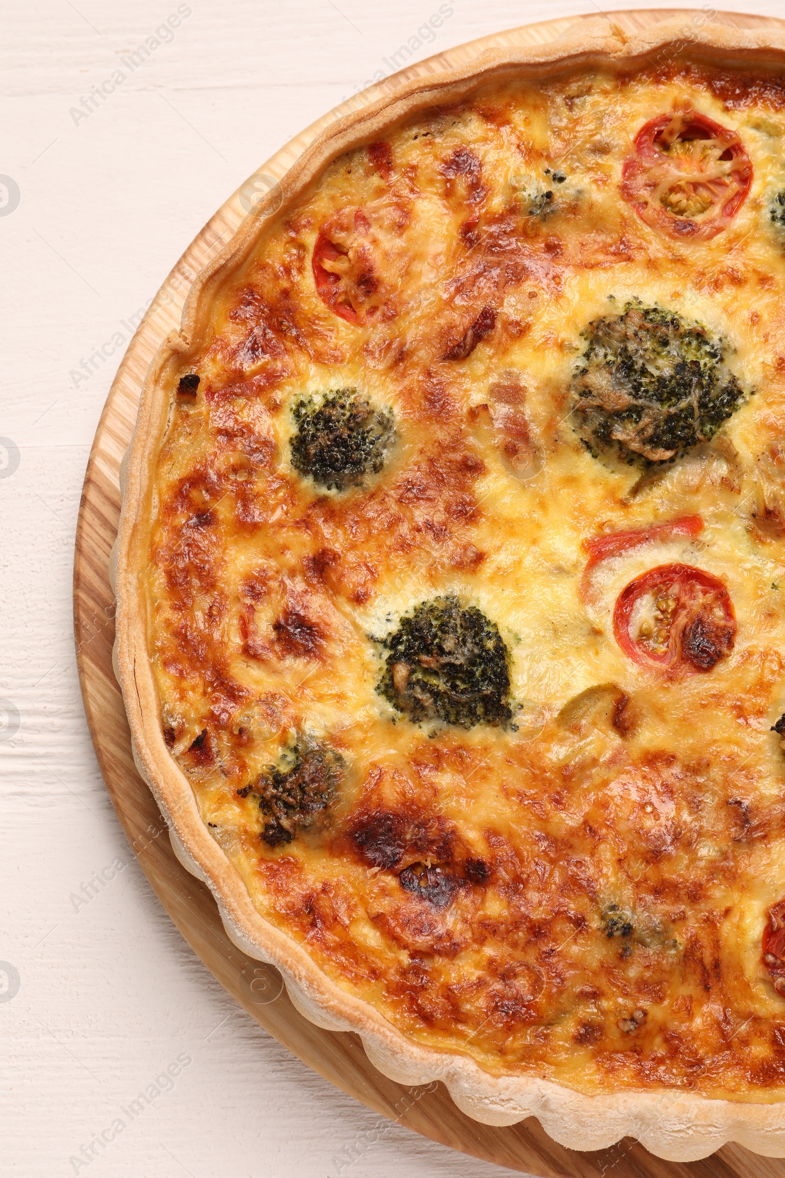 Photo of Delicious homemade vegetable quiche on white table, top view