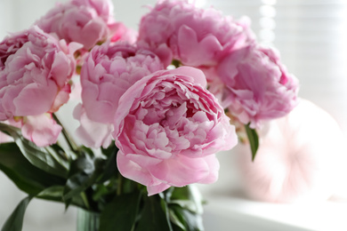 Photo of Bouquet of beautiful pink peonies indoors, closeup