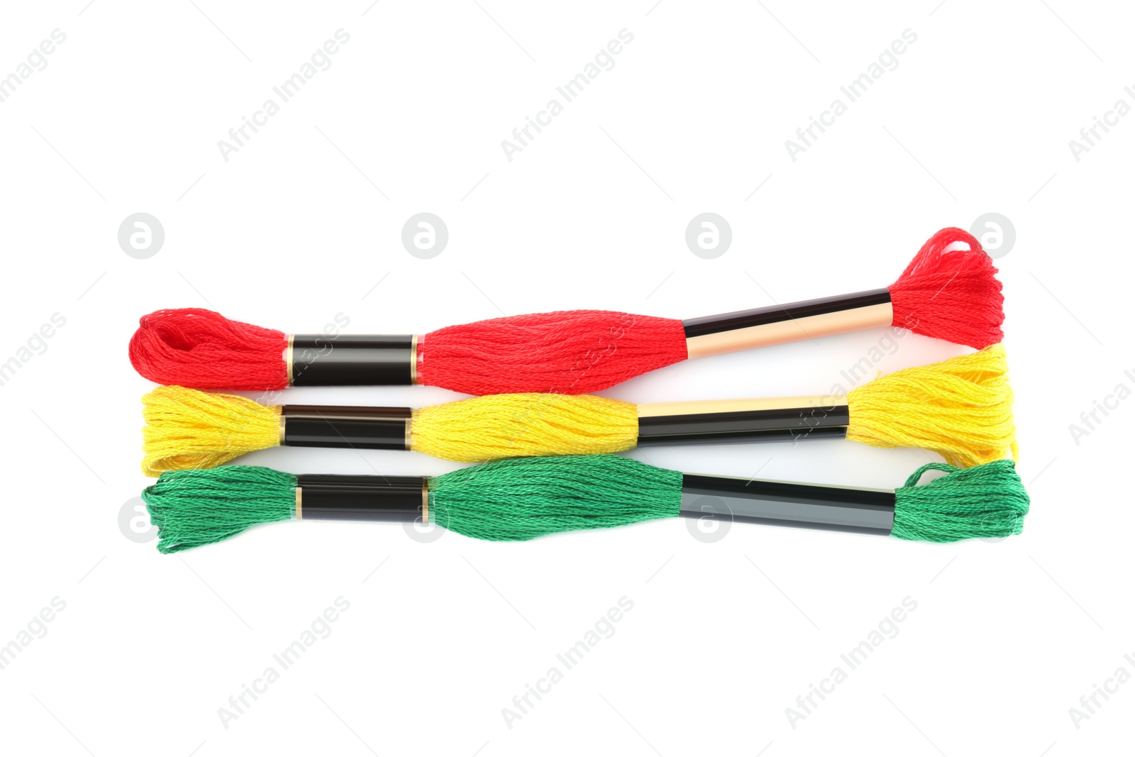 Photo of Set of colorful embroidery threads on white background, top view