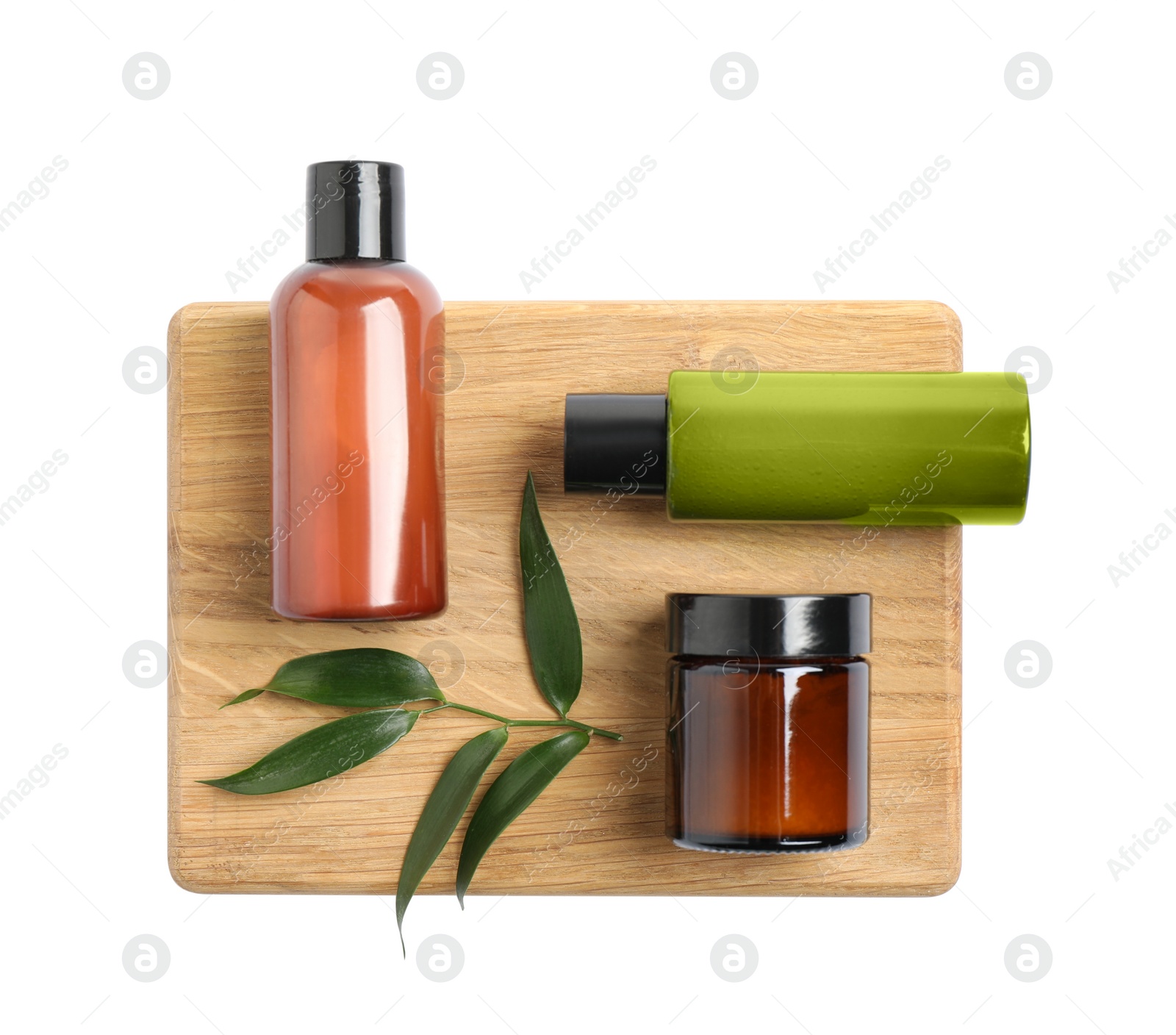 Photo of Bottles with cosmetic products isolated on white, top view. Spa treatment