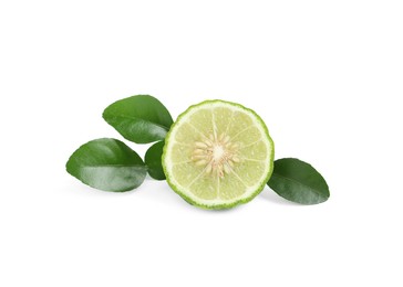 Photo of Half of fresh ripe bergamot fruit and green leaves on white background