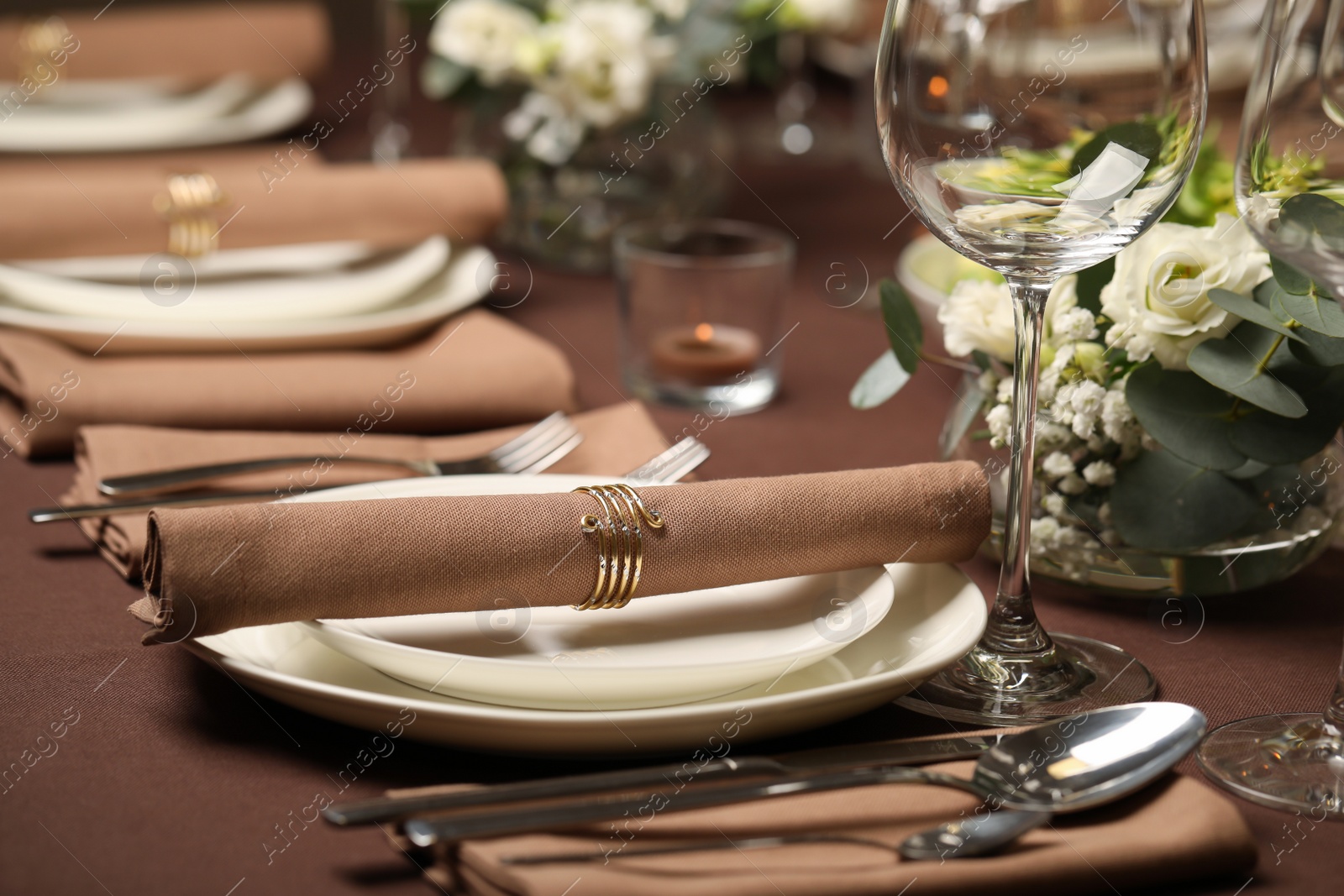 Photo of Stylish elegant table setting for festive dinner in restaurant