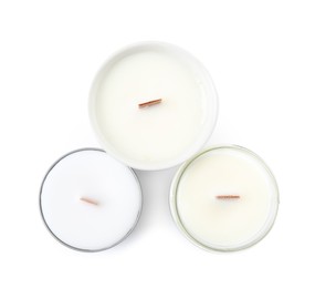 Photo of Beautiful candles with wooden wicks on white background, top view