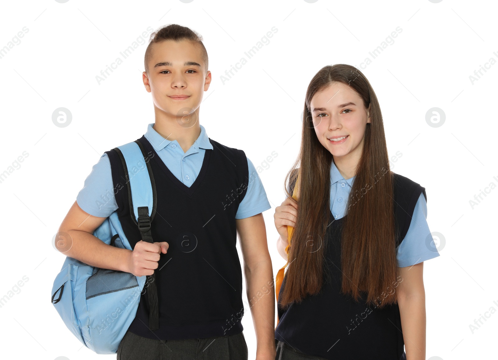 Photo of Portrait of teenagers in school uniform with backpacks on white background