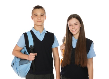 Photo of Portrait of teenagers in school uniform with backpacks on white background