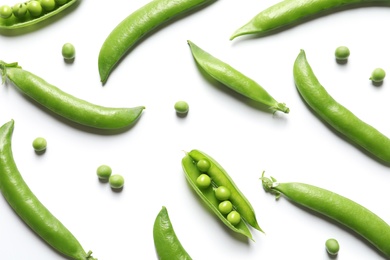 Flat lay composition with fresh peas on white background