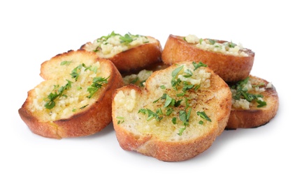 Slices of toasted bread with garlic and herb on white background