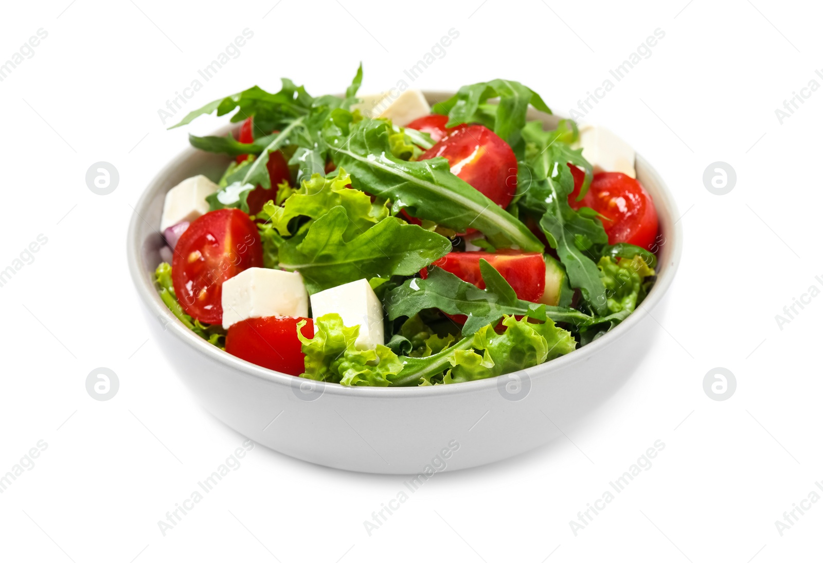 Photo of Delicious salad with arugula and vegetables isolated on white