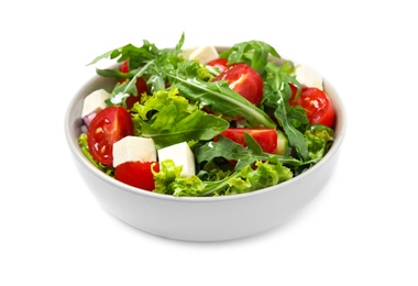 Delicious salad with arugula and vegetables isolated on white