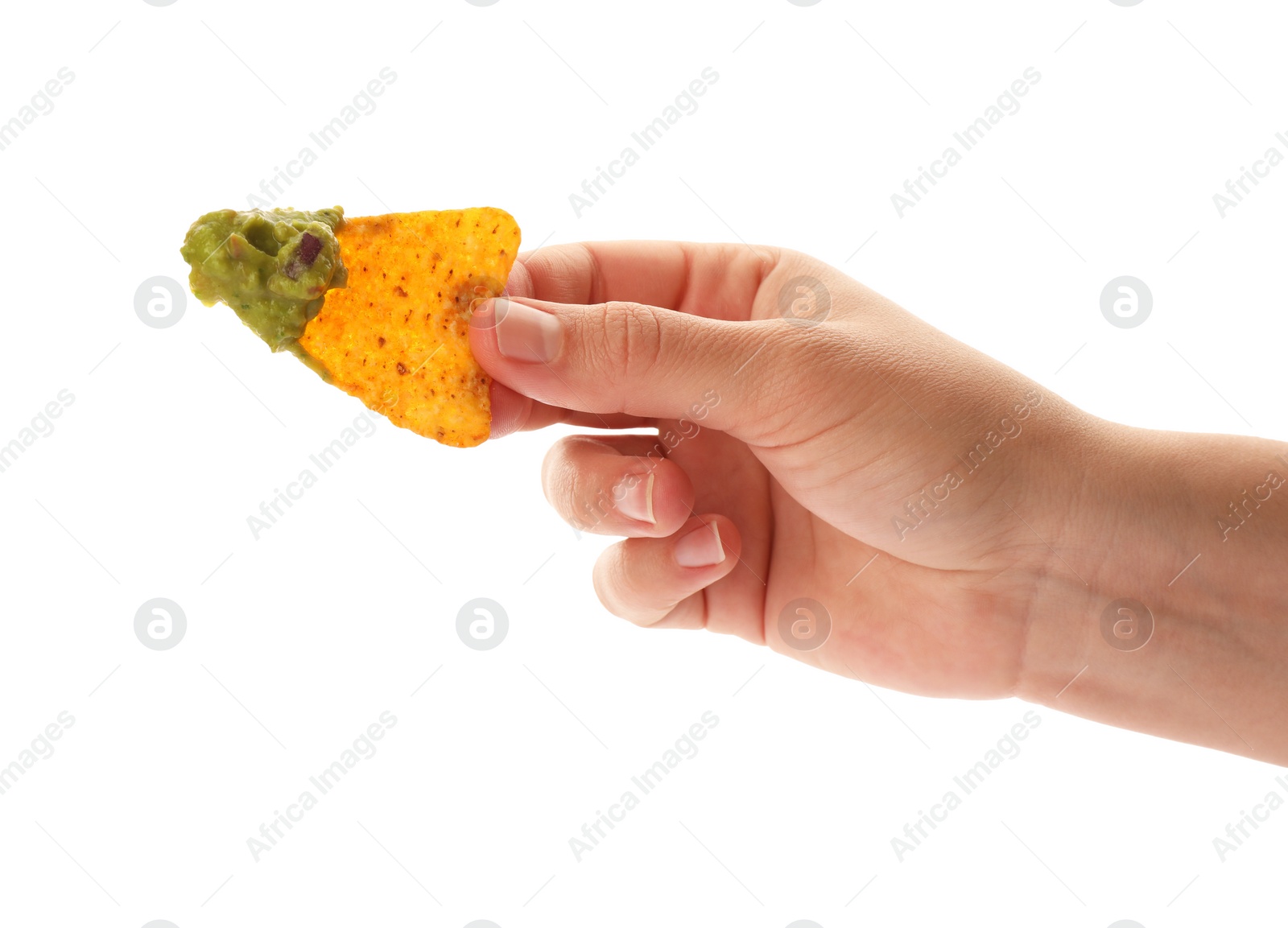 Photo of Woman holding delicious nachos chip with guacamole on white background, closeup