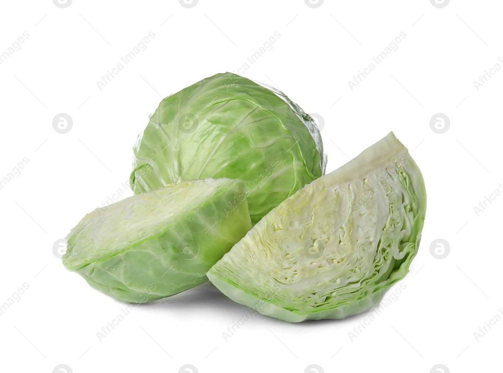 Photo of Whole and sliced cabbages on white background. Healthy food