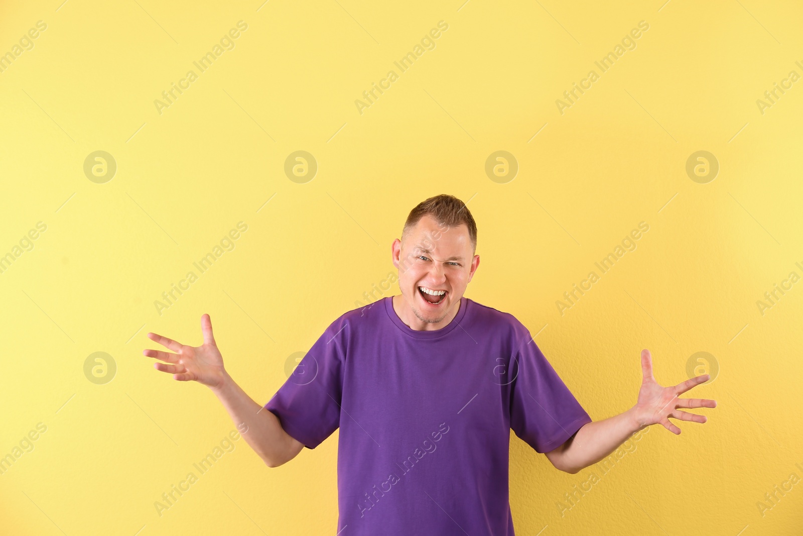Photo of Portrait of handsome man on color background