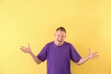 Portrait of handsome man on color background