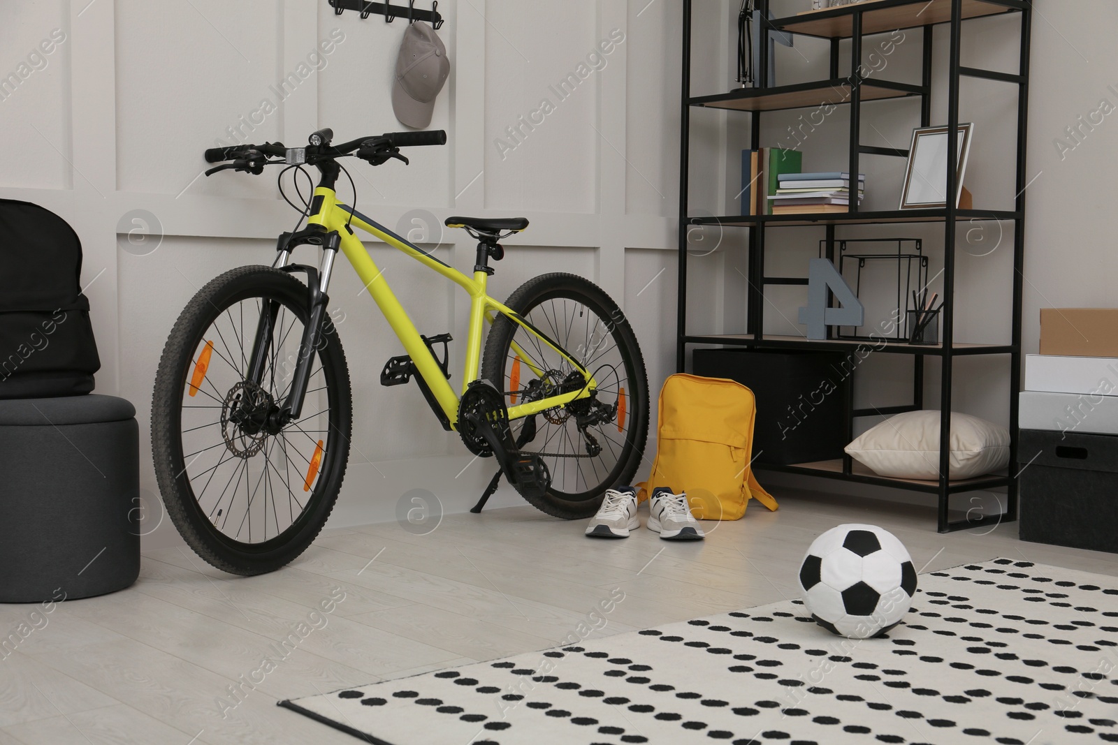 Photo of Sports equipment in stylish teenager's room interior