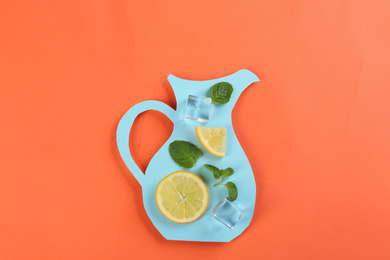 Photo of Creative lemonade layout with lemon slices, mint and ice cubes on coral background, top view