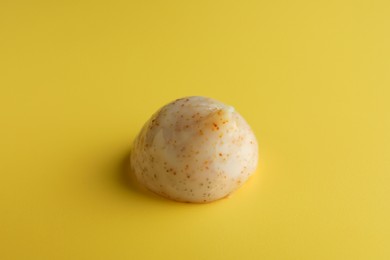 Sample of face scrub on yellow background