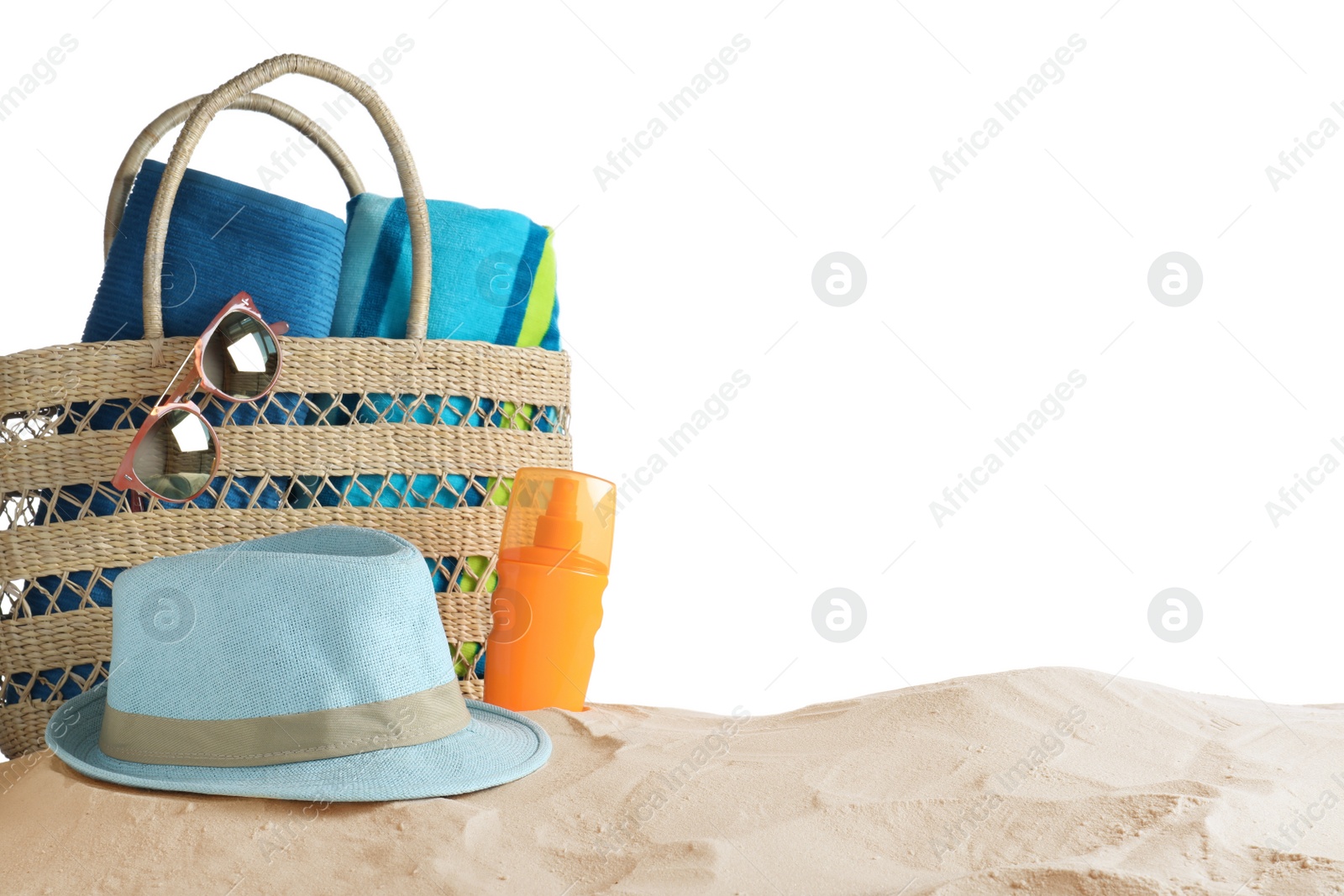 Photo of Composition with beach objects on sand against white background. Space for text