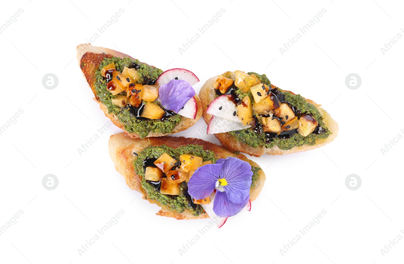 Photo of Delicious bruschettas with pesto sauce, tomatoes and balsamic vinegar isolated on white, top view