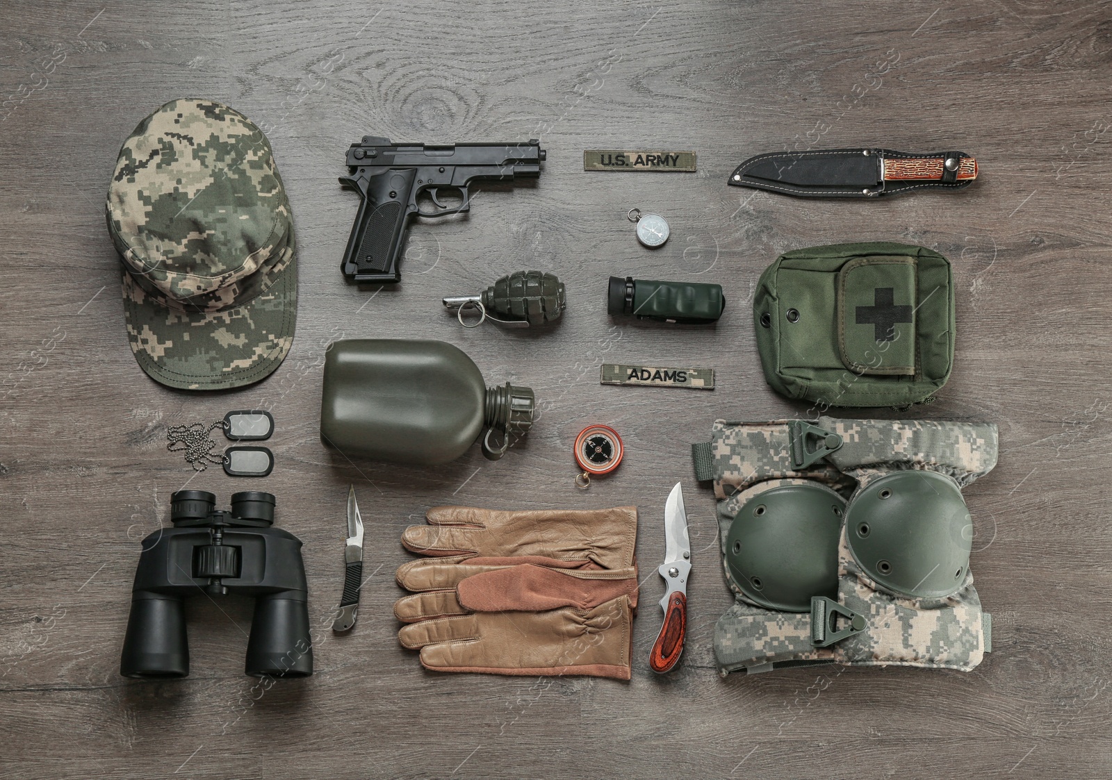 Photo of Set of military equipment on wooden background, flat lay