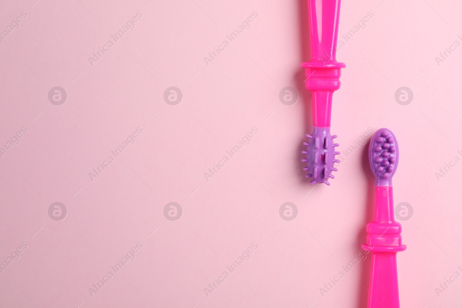 Photo of Manual toothbrushes for children on color background, top view with space for text