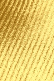 Image of Corrugated golden texture as background, closeup view