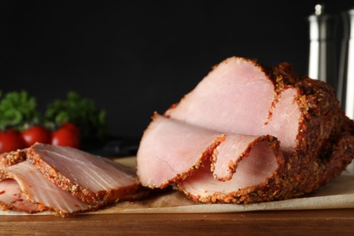Board with delicious ham for dinner on table