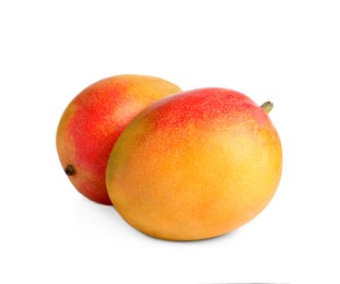 Delicious ripe juicy mangoes on white background