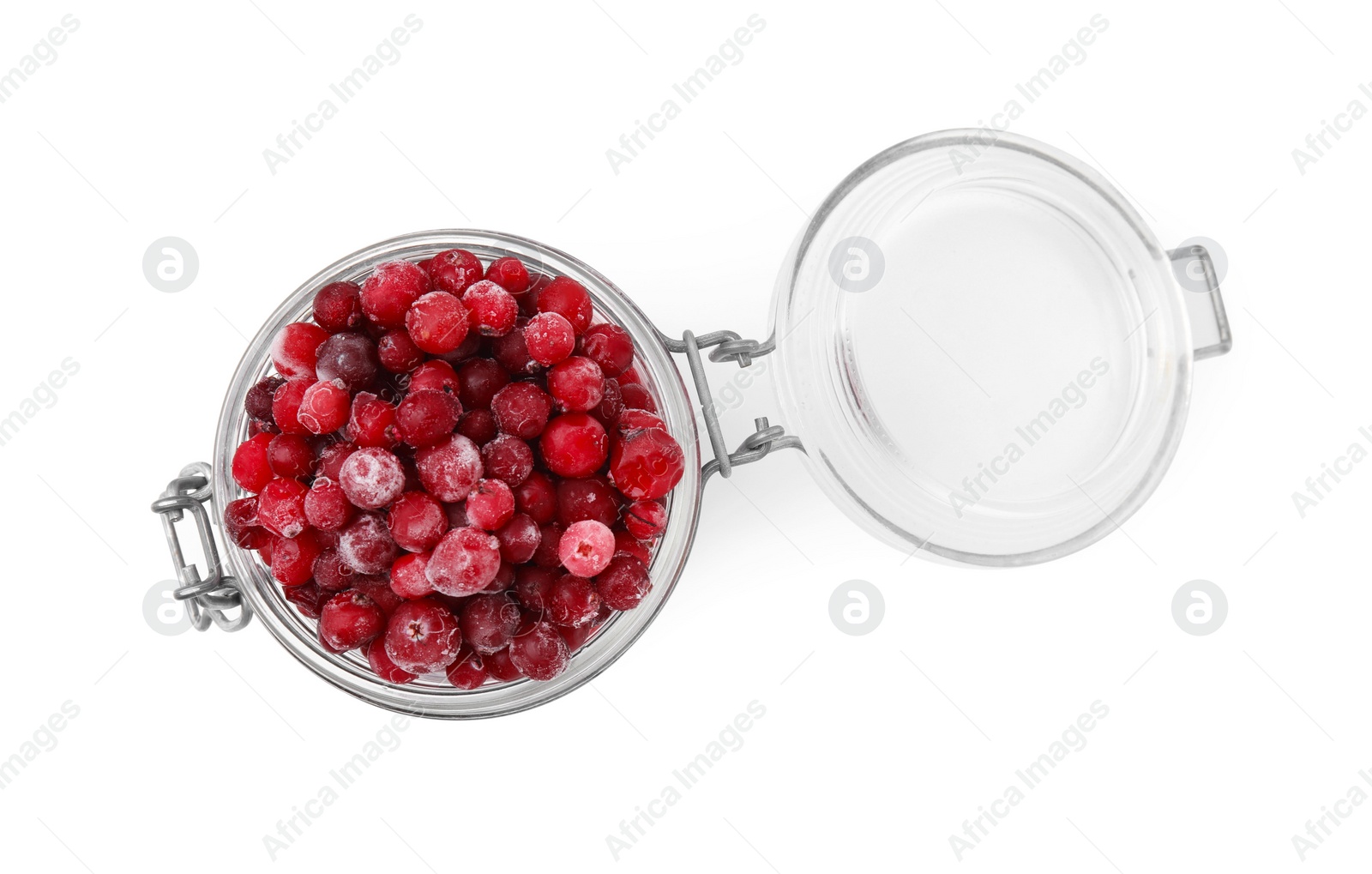 Photo of Frozen red cranberries in glass jar isolated on white, top view